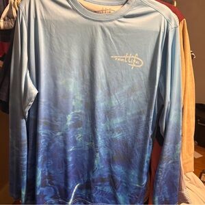 Blue long sleeve Reel Life fishing swim shirt